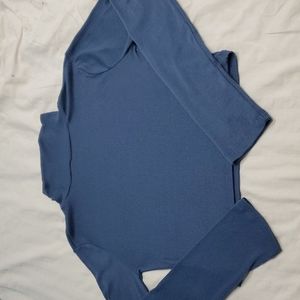 Long sleeve turtle neck cropped top.